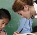 Teacher helping Student